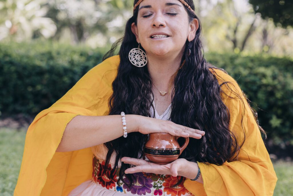 Woman healer offering cacao ceremony