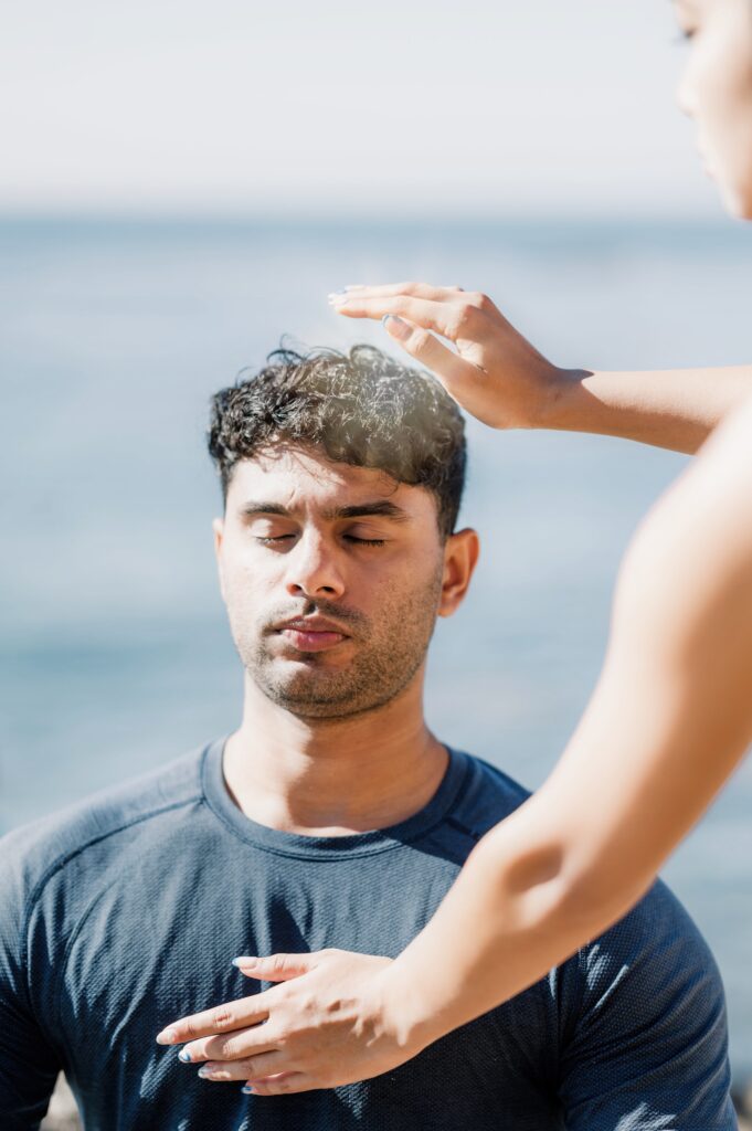 Healer giving reiki to client