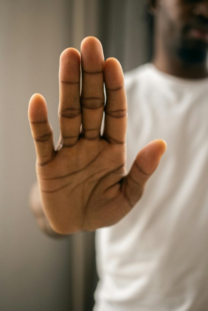 Man holding hand up in stop motion