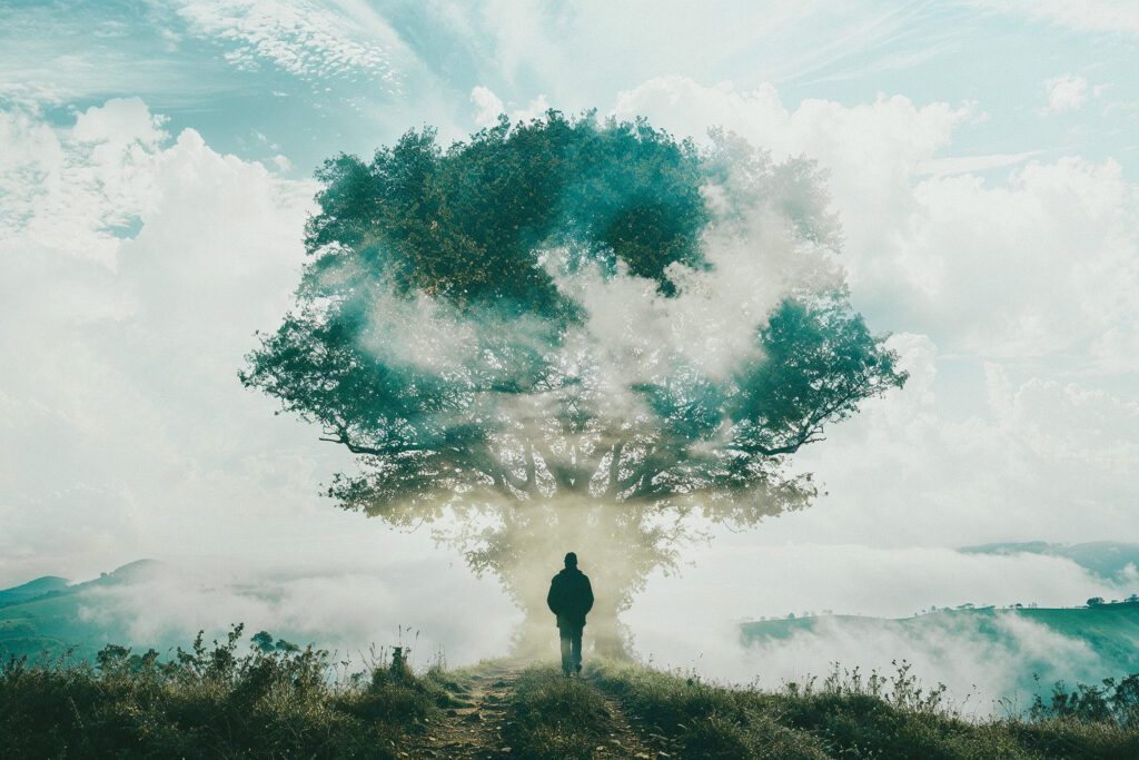 Man in front of tree