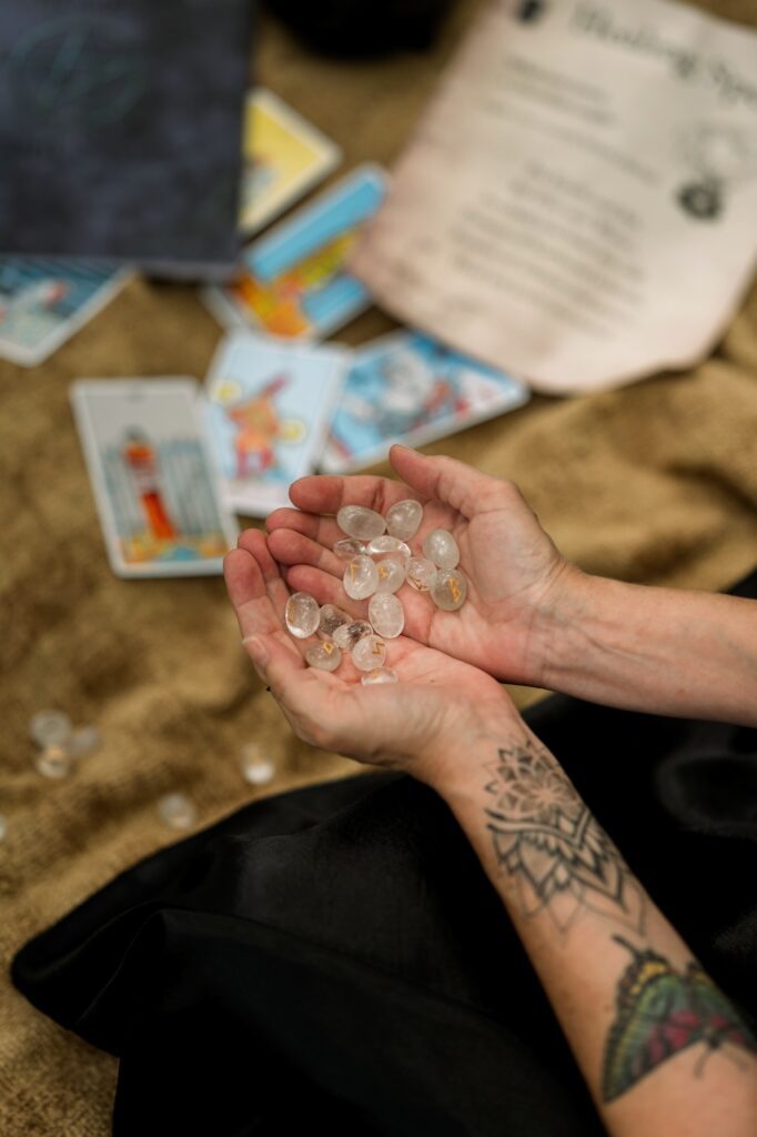 Woman holding Runes in hands
