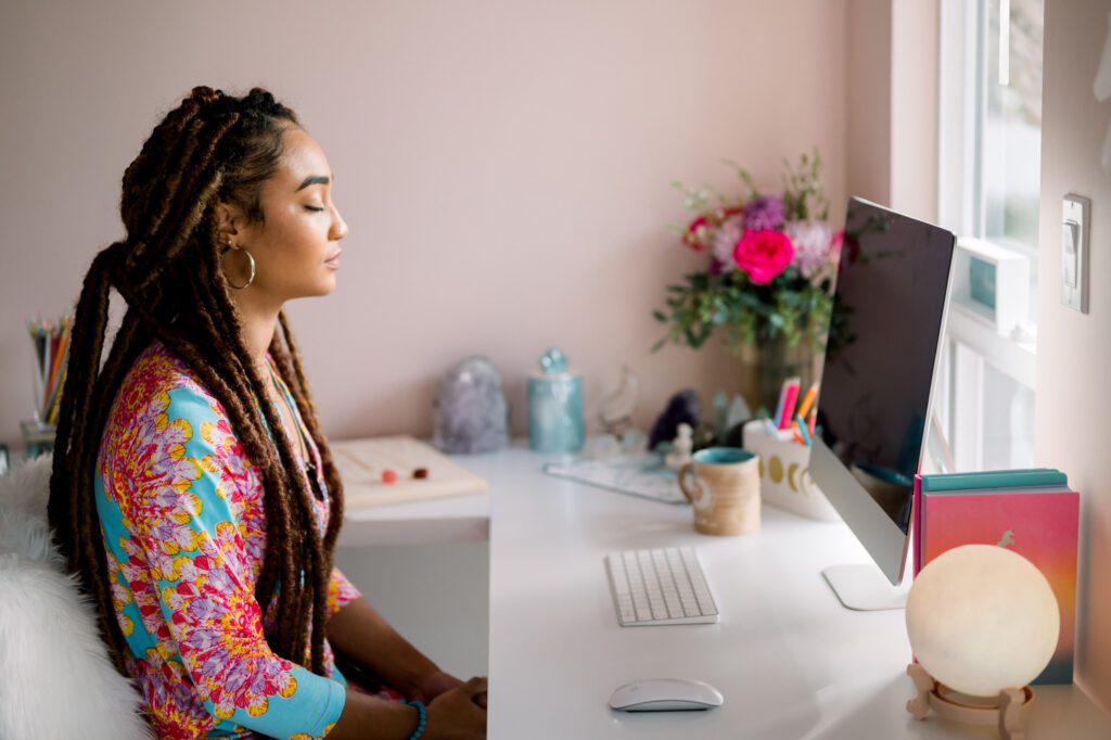 Woman receiving distance healing on computer