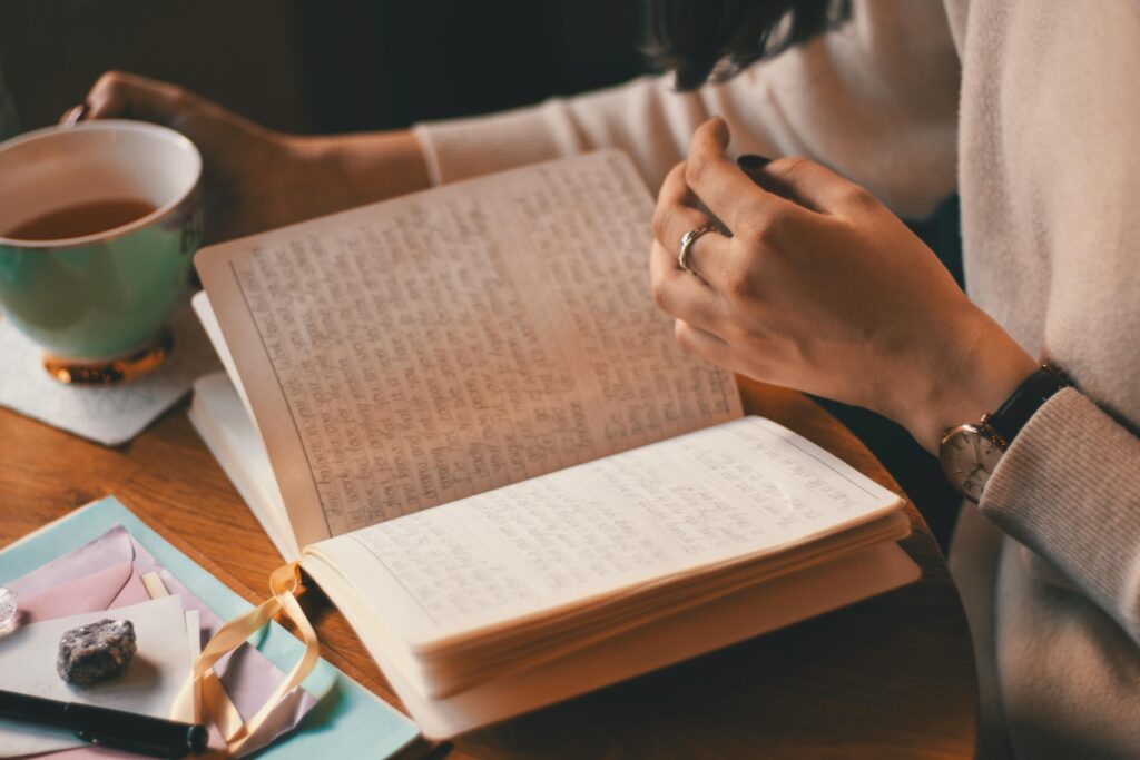 WOman journaling with tea